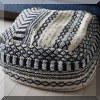 F47. Pouf with woven upholstery. 